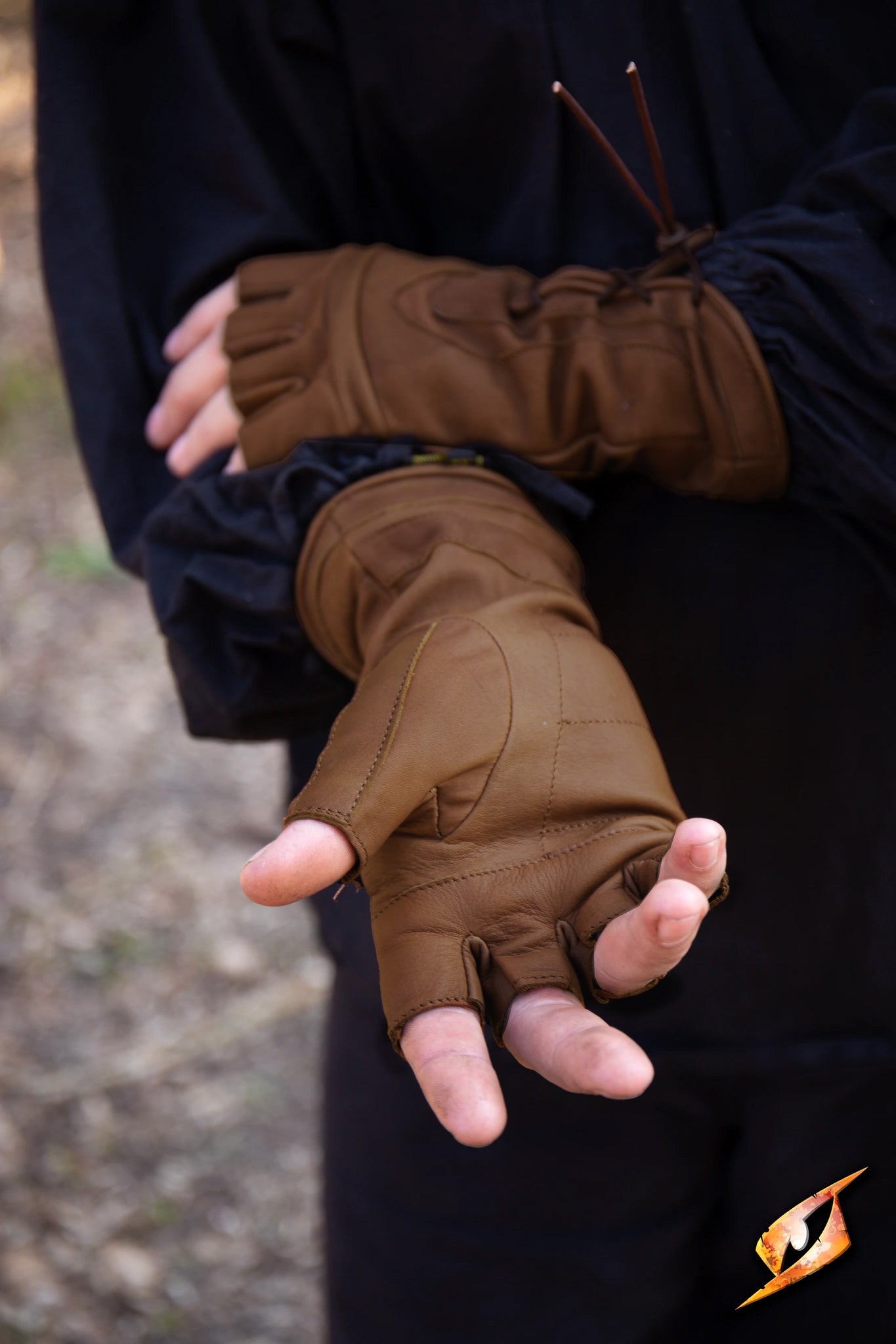 Thief Gloves displayed on a person showing fingerless design for stealth and dexterity.