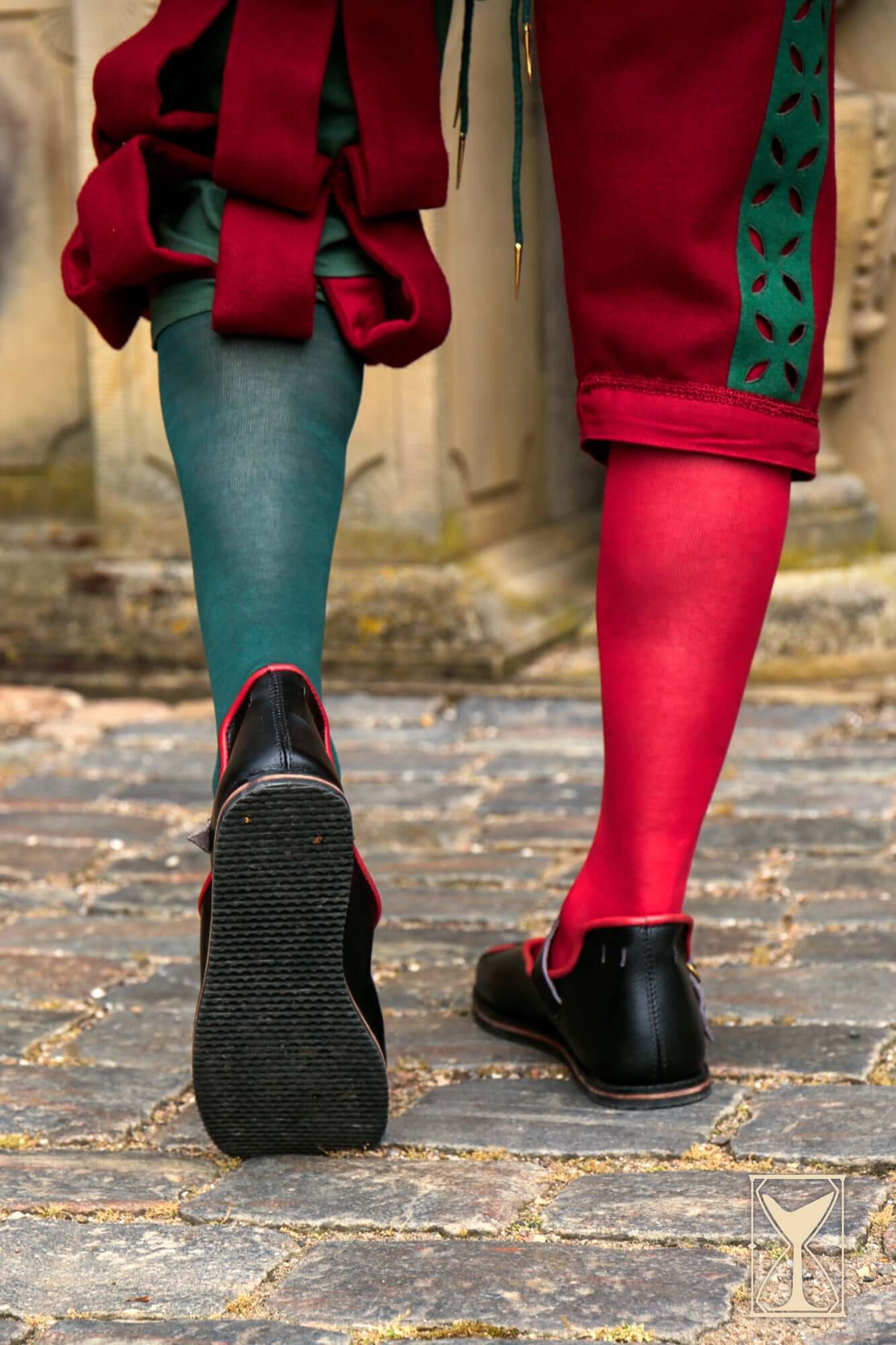 Rich Landsknecht Shoes worn with colorful stockings, showcasing flamboyant Renaissance fashion.