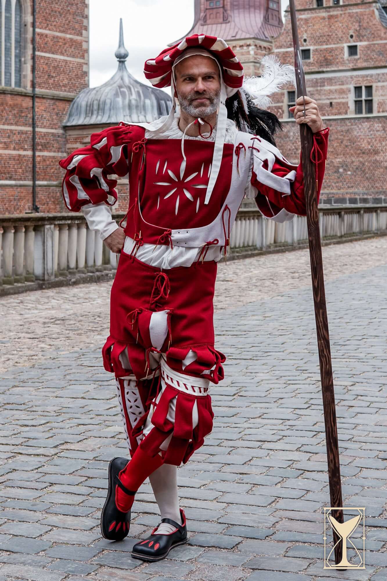 Rich Landsknecht Shoes worn by a model in a vibrant Renaissance costume, showcasing striking historical fashion.