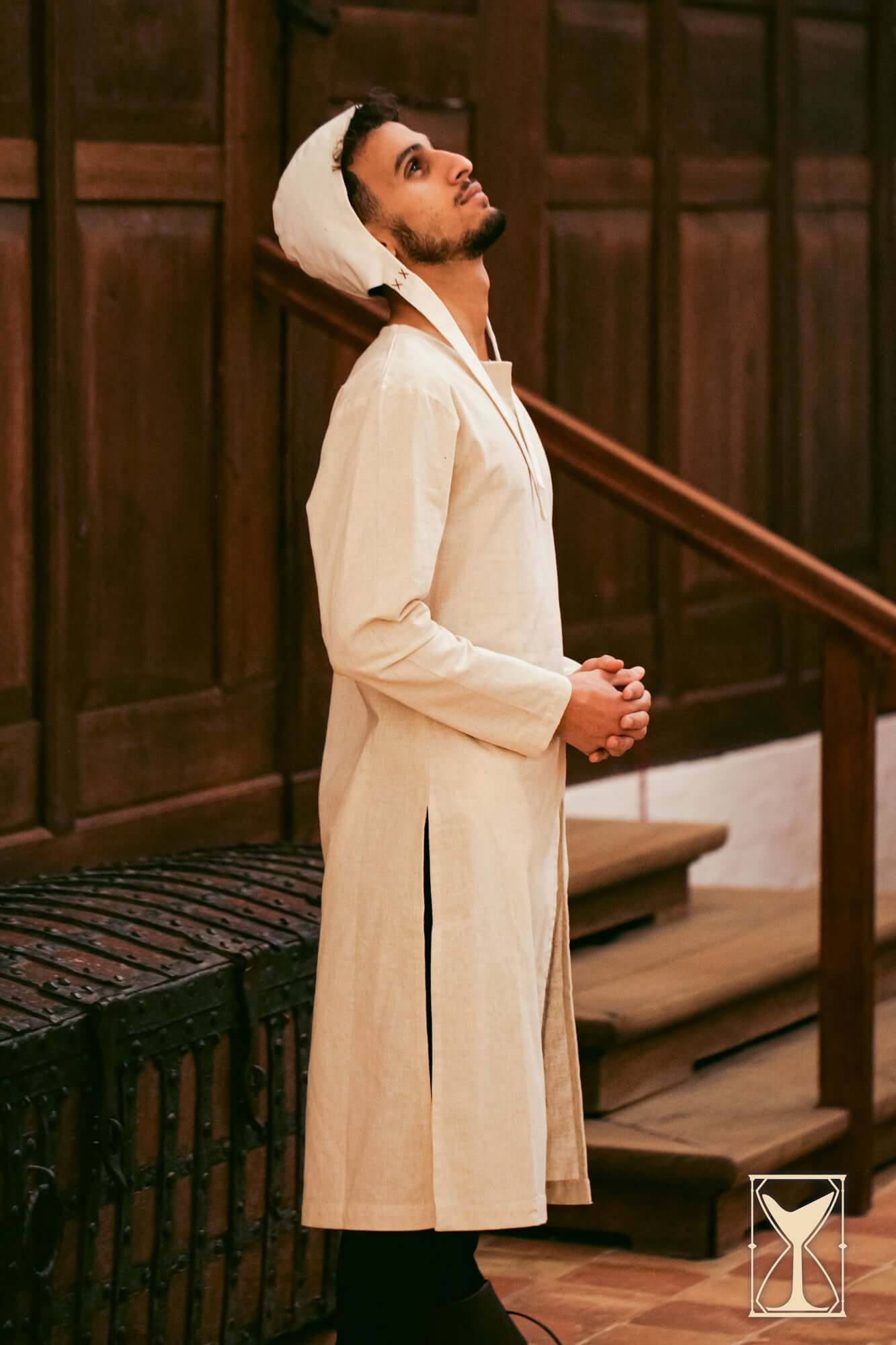 Medieval Riding Tunic worn by a model in a historical setting, showcasing its design and functionality.