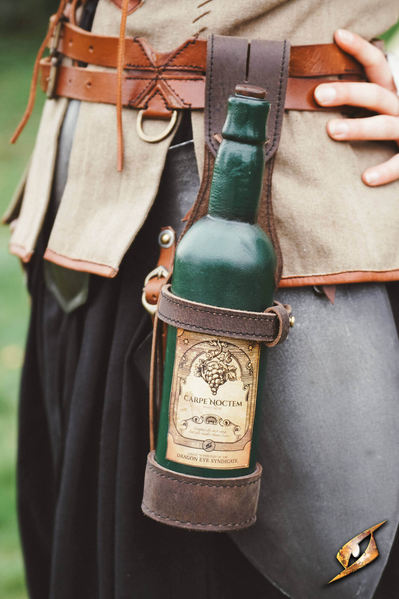 Bottle Holder - Dark Brown carrying a green wine bottle, featured in a leather belt-mounted design.