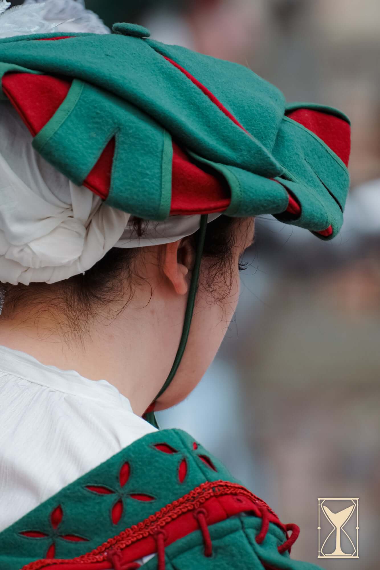 Landsknecht Hat worn by a participant showcasing vibrant colors and 16th-century style.