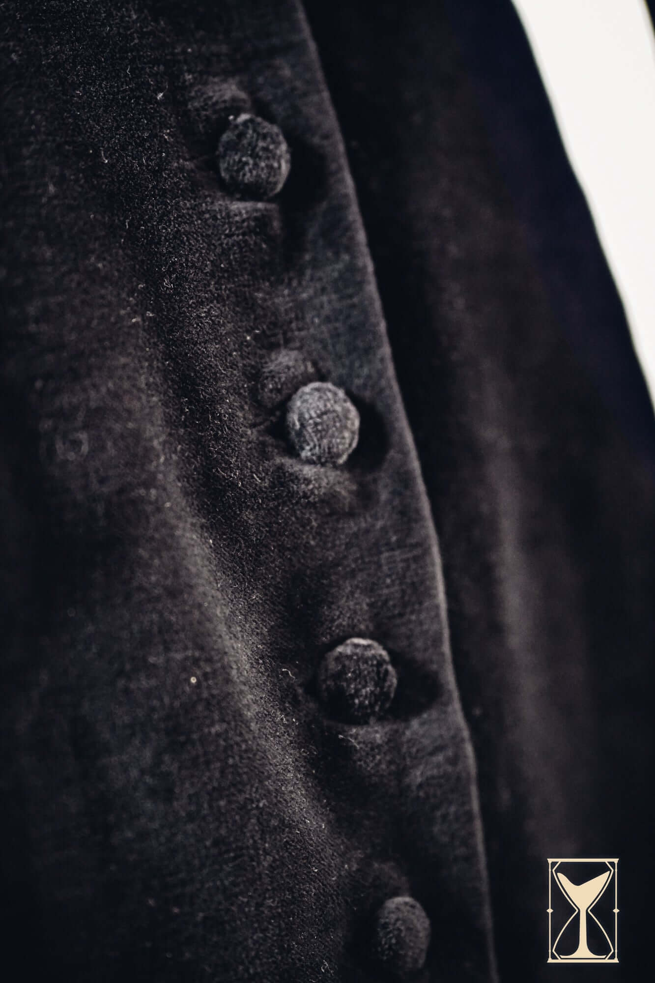 Close-up of the Velvet Surcoat showcasing distinctive fabric and unique buttons for medieval and fantasy fashion.