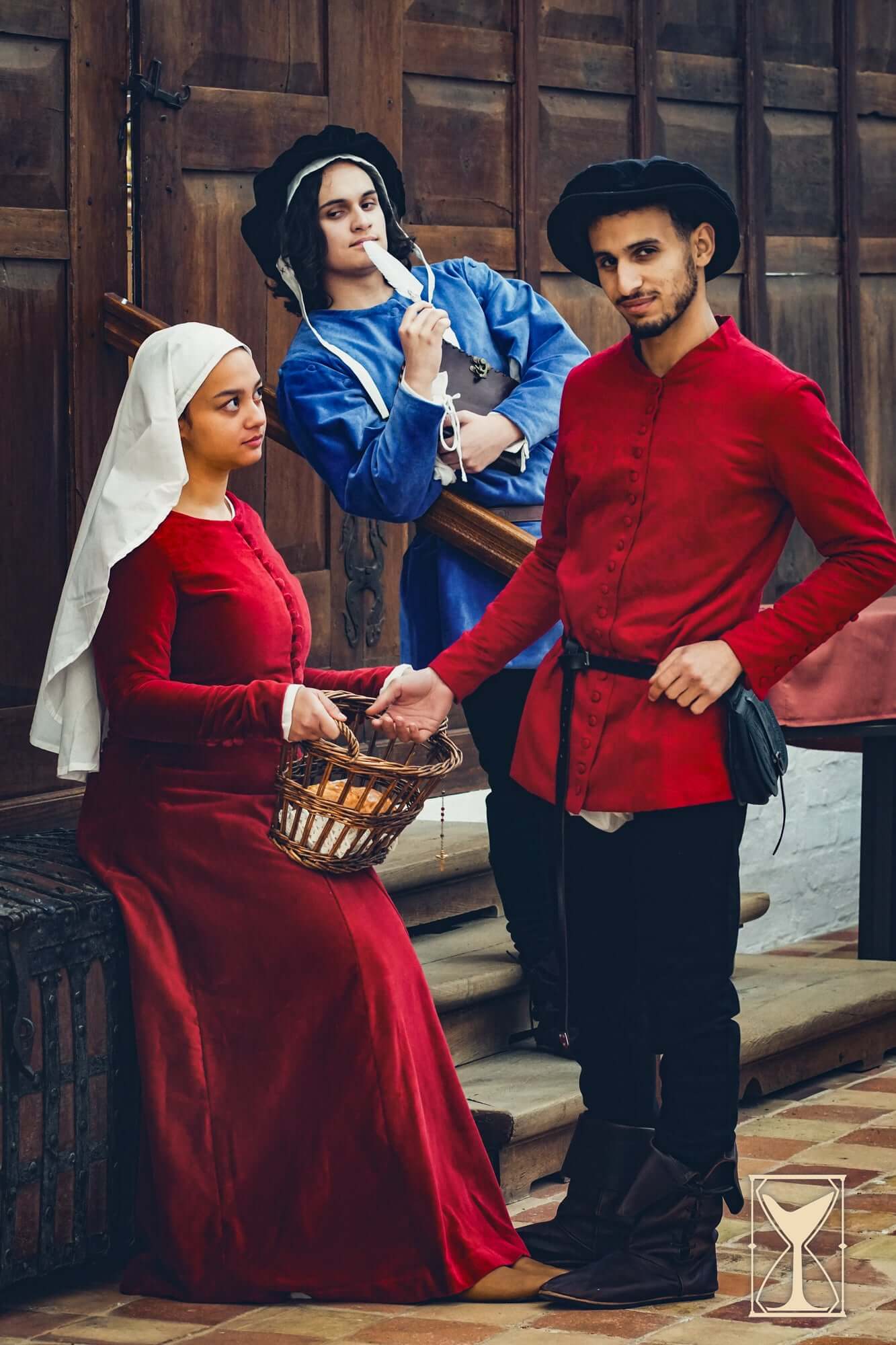 Flat Hat Edward worn by models in historical Renaissance attire featuring traditional clothing from the 16th century.