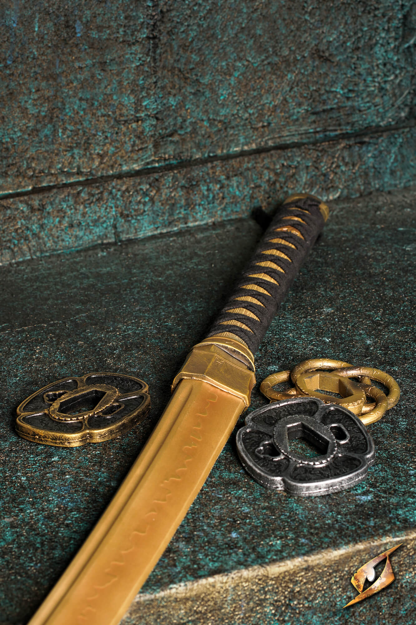 Mokko-gata Tsuba displayed alongside a katana, showcasing its classic four-lobed design and flexible polyurethane material.