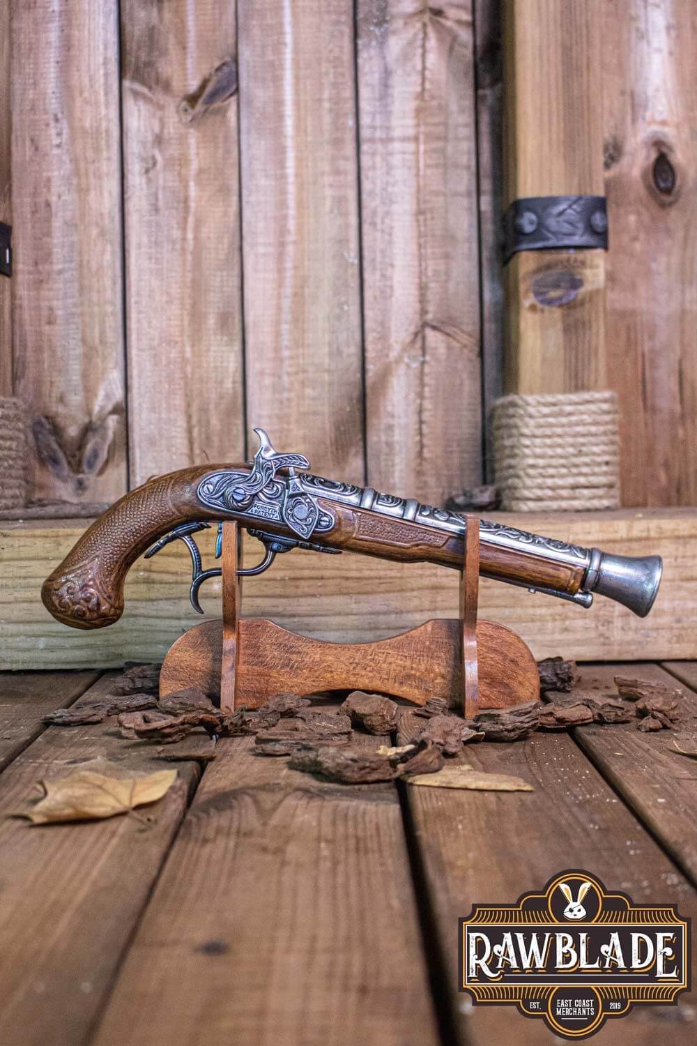 Thunder Gun displayed on a wooden stand, showcasing its detailed design and craftsmanship by Rawblade.