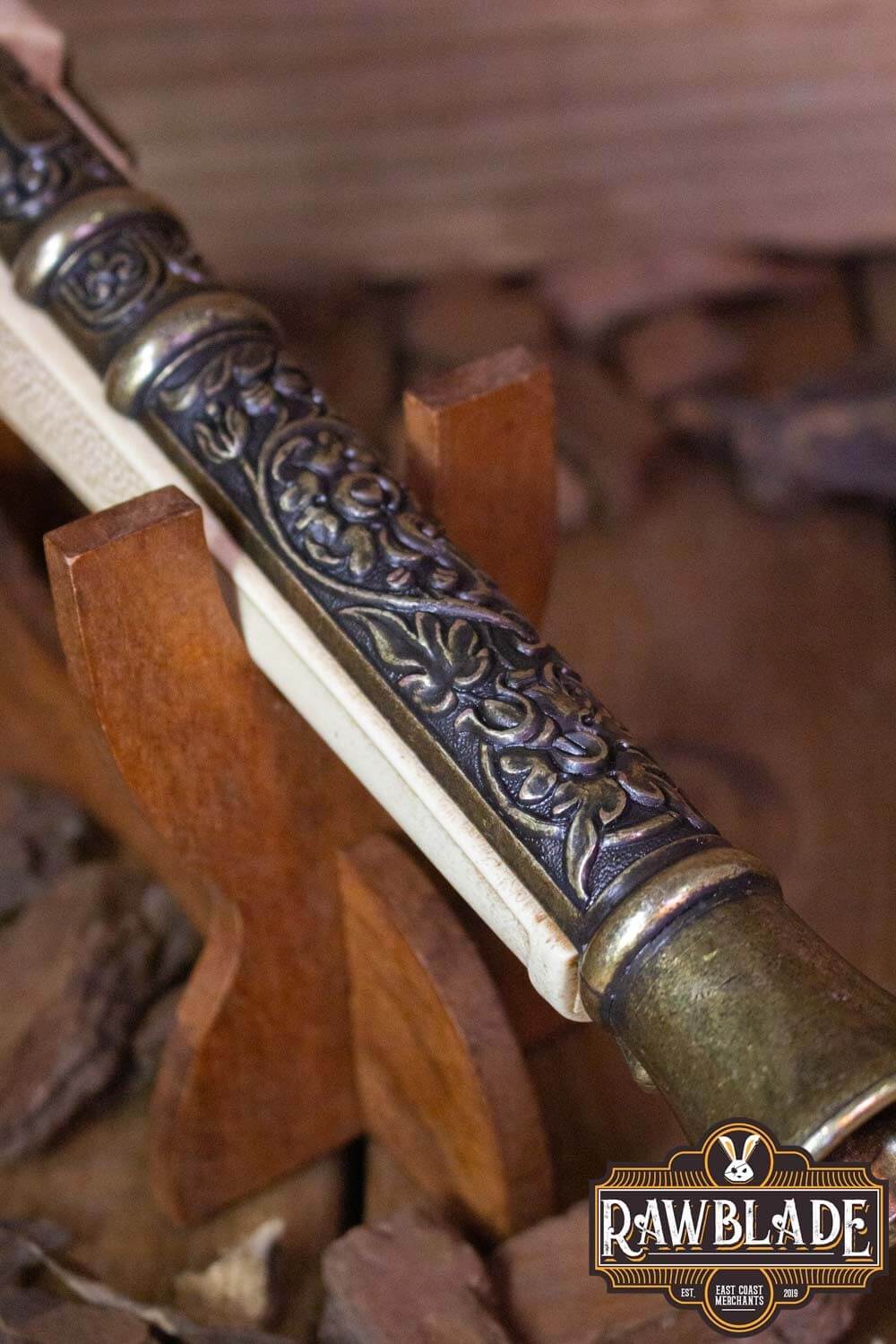 Detailed view of the Thunder Gun's ornate handle on display, showcasing its craftsmanship and design.