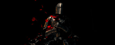 Knight in medieval metal armor posing in a black space with a roses