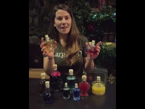 Woman showcasing various colorful potion flasks, perfect for LARP and cosplay, featuring the Potion of Adventure.